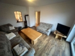 Wohnzimmer - Gepflegtes Reihenmittelhaus in ruhiger Lage von Ahlhorn.